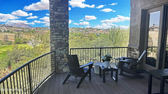 wooden deck with a mountain view