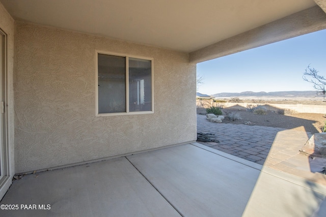 view of patio / terrace with a mountain view