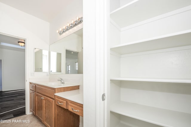 bathroom with vanity and tile patterned flooring