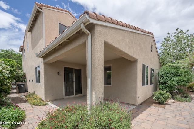 1891 N Tin Strap Trl, Prescott Valley, AZ 86314 - back of house with a patio area, stucco siding, and a tiled roof