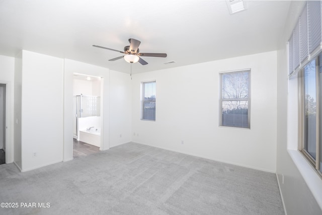 1891 N Tin Strap Trl, Prescott Valley, AZ 86314 - unfurnished bedroom featuring carpet floors, baseboards, ceiling fan, and connected bathroom