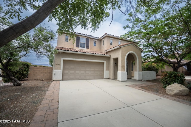 1891 N Tin Strap Trl, Prescott Valley, AZ 86314 - mediterranean / spanish home with stucco siding, concrete driveway, a tiled roof, and a garage