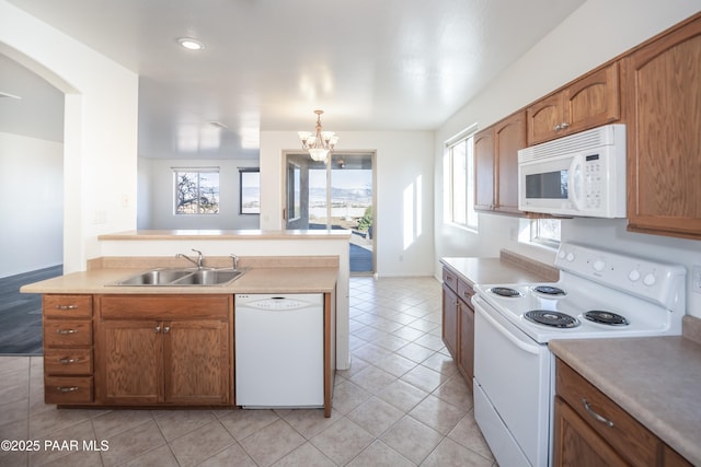 1891 N Tin Strap Trl, Prescott Valley, AZ 86314 - kitchen featuring white appliances, a sink, light tile patterned floors, and healthy amount of natural light