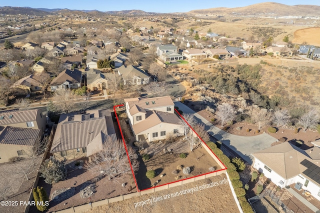 birds eye view of property featuring a mountain view