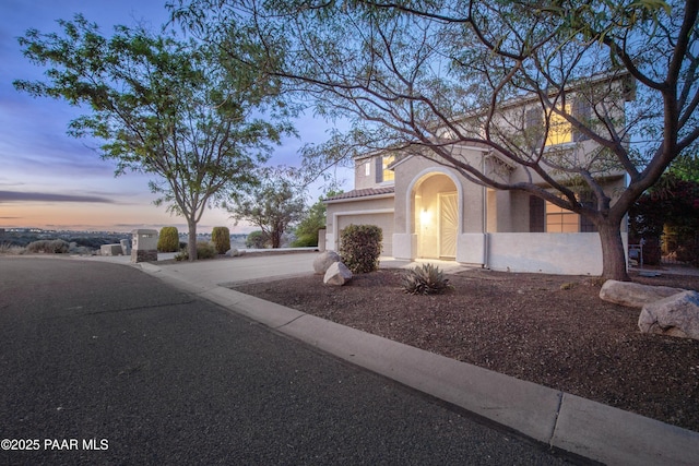 1891 N Tin Strap Trl, Prescott Valley, AZ 86314 - view of front of property featuring a garage, concrete driveway, and stucco siding