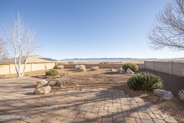 view of patio / terrace with a mountain view