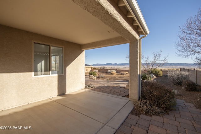 view of patio / terrace featuring a mountain view