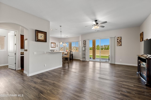 6286 E Livingston Loop, Prescott Valley, AZ 86314 - living area with a ceiling fan, dark wood finished floors, recessed lighting, and arched walkways