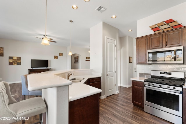 6286 E Livingston Loop, Prescott Valley, AZ 86314 - kitchen with appliances with stainless steel finishes, open floor plan, ceiling fan, light countertops, and recessed lighting