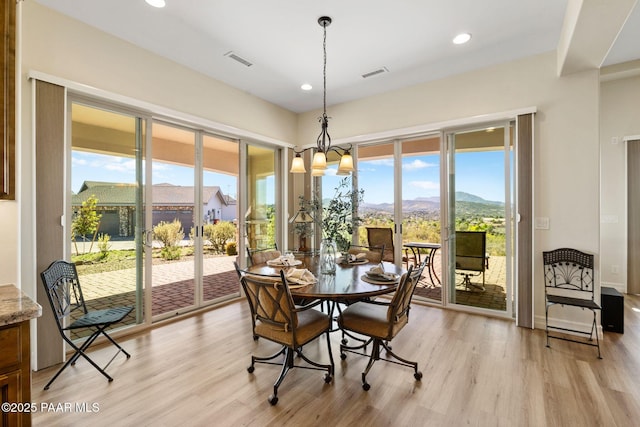 1032 Vantage Point Cir, Prescott, AZ 86301 - dining area featuring light wood-type flooring, recessed lighting, a mountain view, and a chandelier