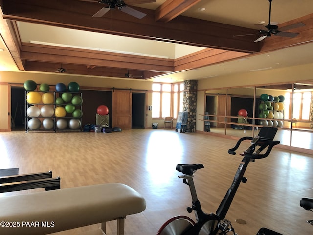 1032 Vantage Point Cir, Prescott, AZ 86301 - gym featuring a ceiling fan, beam ceiling, wood finished floors, and a barn door