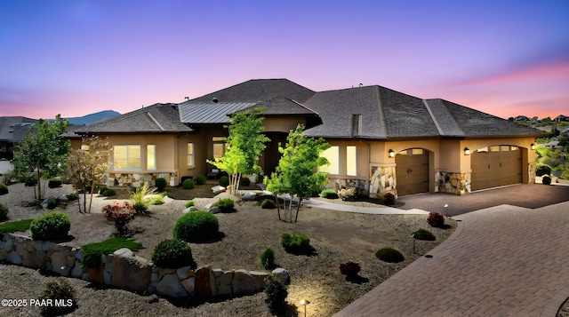 1032 Vantage Point Cir, Prescott, AZ 86301 - view of front of property with stone siding, stucco siding, an attached garage, and decorative driveway