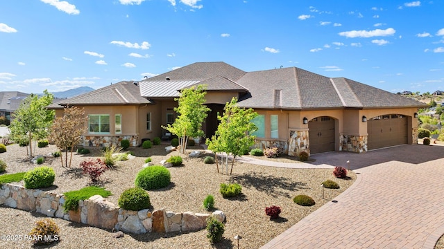 1032 Vantage Point Cir, Prescott, AZ 86301 - view of front of property with stone siding, stucco siding, a garage, and driveway