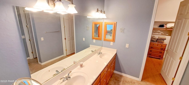 bathroom featuring vanity and wood-type flooring