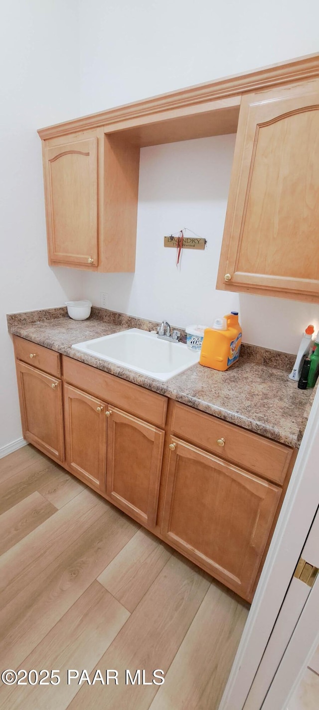 kitchen featuring light hardwood / wood-style floors and sink