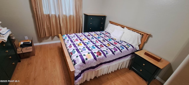 bedroom featuring light hardwood / wood-style floors