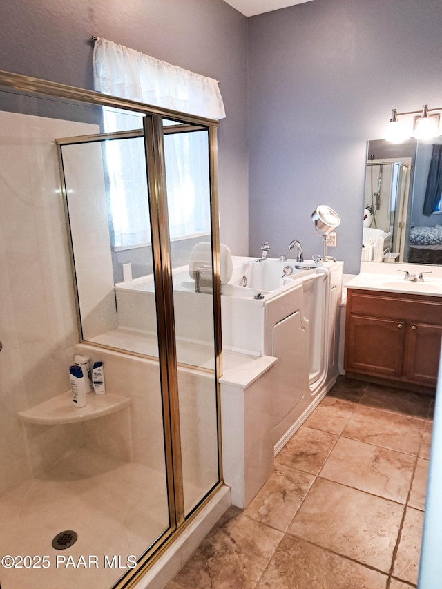 bathroom with plus walk in shower and vanity