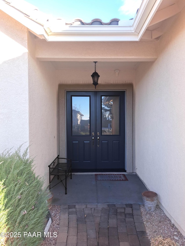 doorway to property featuring french doors