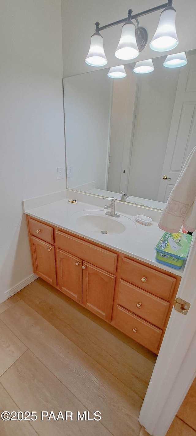 bathroom featuring hardwood / wood-style floors and vanity