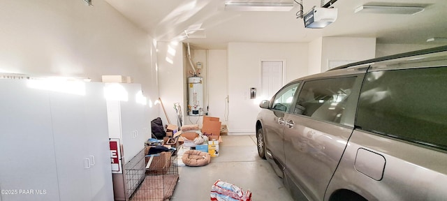 garage featuring gas water heater and a garage door opener