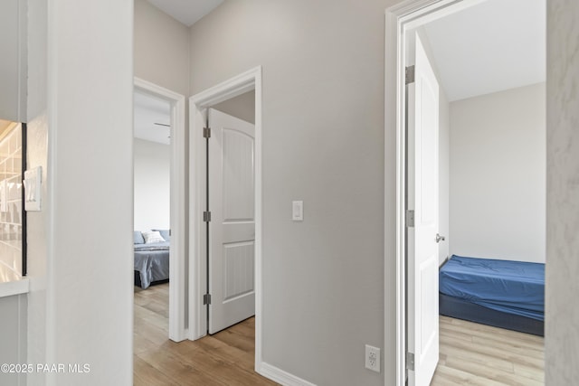 corridor featuring light hardwood / wood-style flooring