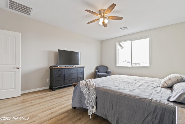 bedroom with ceiling fan and light hardwood / wood-style flooring