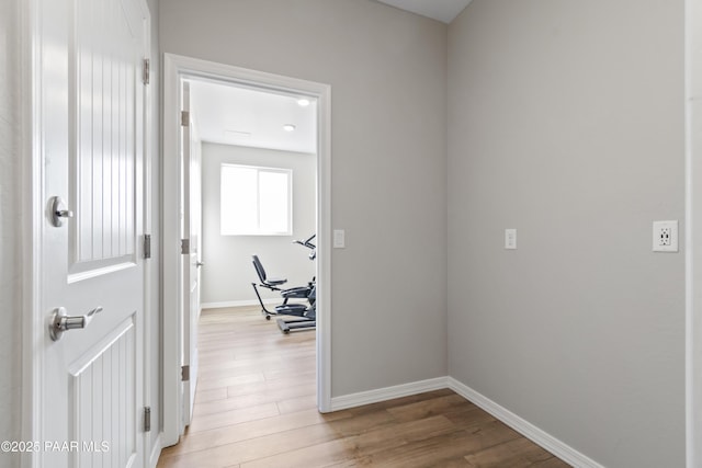 hall with light hardwood / wood-style flooring