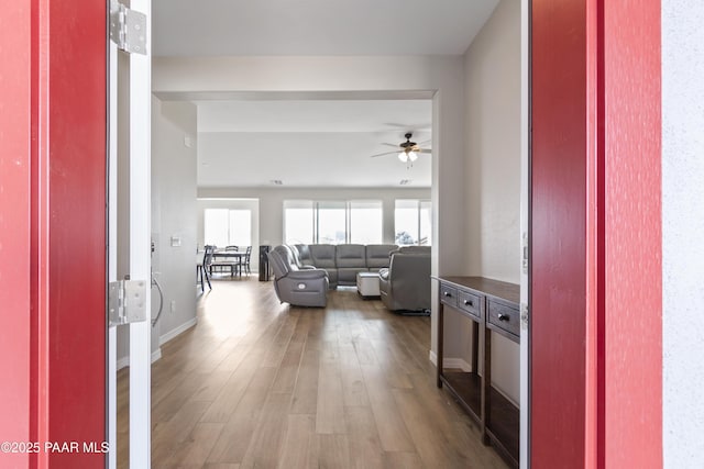 interior space featuring dark hardwood / wood-style flooring and ceiling fan