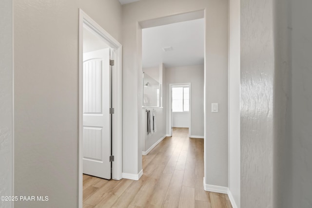 hallway featuring light hardwood / wood-style flooring