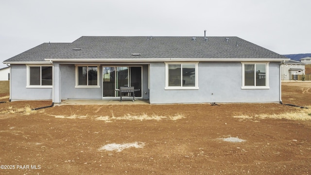 rear view of property with a patio area