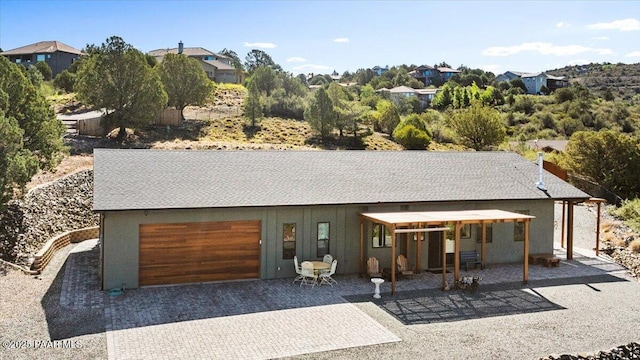749 S Montezuma St, Prescott, AZ 86303 - view of front facade with a garage, driveway, and a patio area
