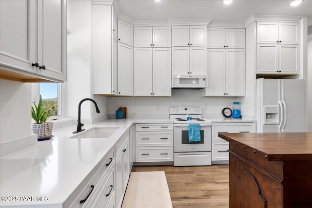 749 S Montezuma St, Prescott, AZ 86303 - kitchen featuring white appliances, recessed lighting, light wood-style floors, white cabinets, and range hood
