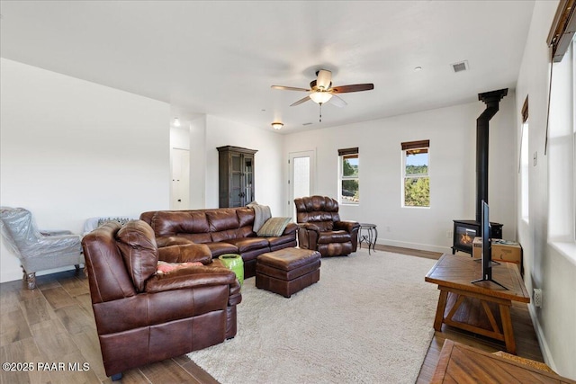 749 S Montezuma St, Prescott, AZ 86303 - living area featuring a wood stove, wood finished floors, and ceiling fan