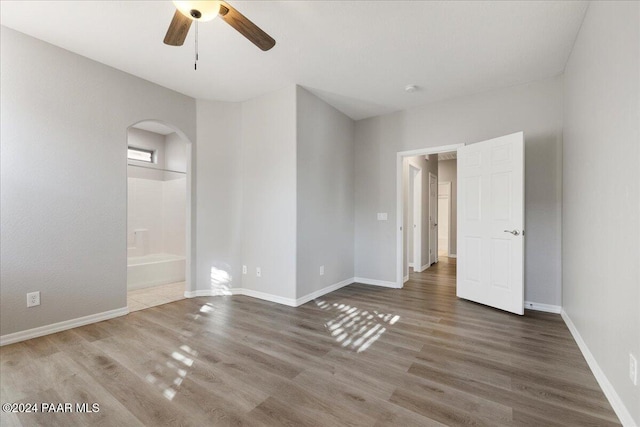 empty room featuring hardwood / wood-style floors and ceiling fan