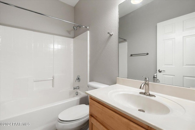 full bathroom with bathtub / shower combination, vanity, and toilet