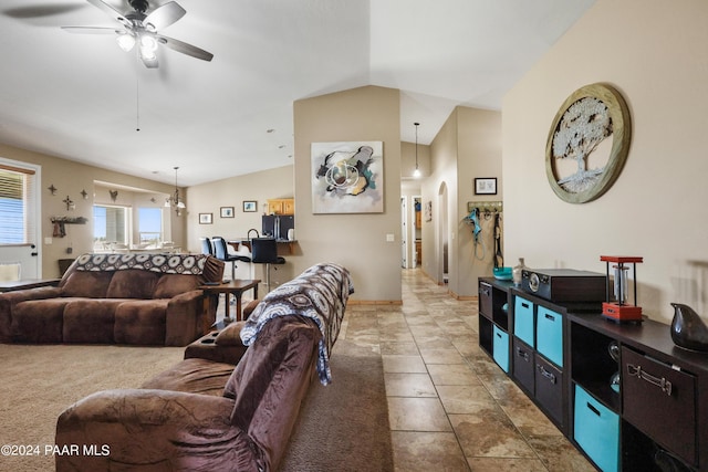 living room with tile patterned floors, ceiling fan, and lofted ceiling