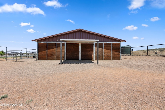 view of outbuilding featuring a rural view