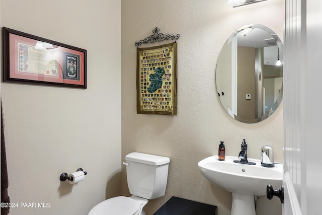 bathroom with sink and toilet