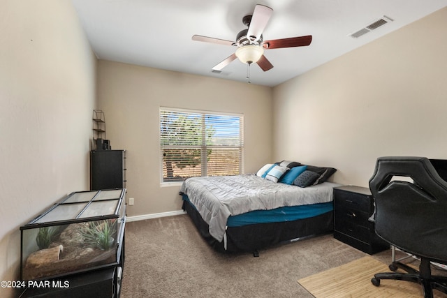 bedroom with ceiling fan and carpet floors