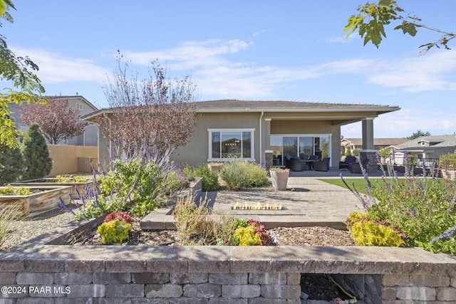 back of property featuring a patio area