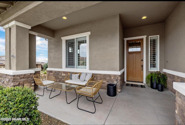 view of exterior entry featuring a porch