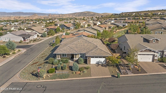 drone / aerial view featuring a mountain view