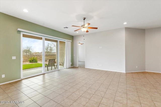 kitchen featuring brown cabinets, open floor plan, ceiling fan, and stainless steel appliances
