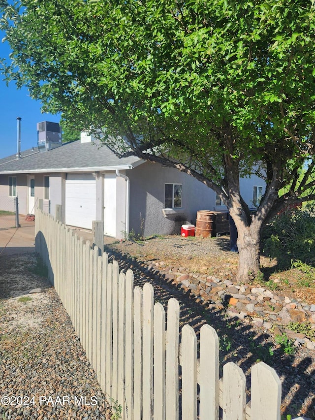 view of side of property with a garage