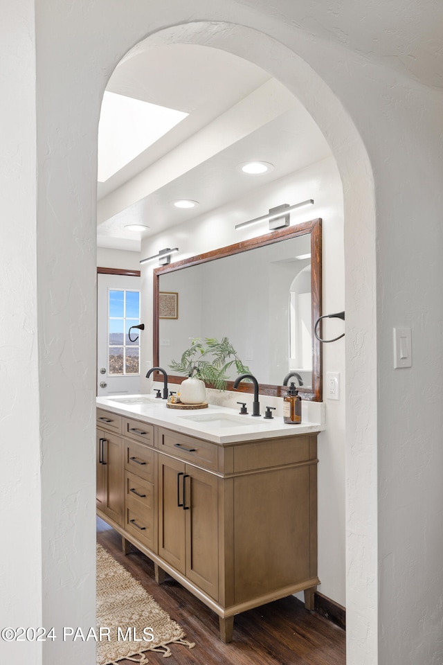 bathroom featuring wood-type flooring and vanity