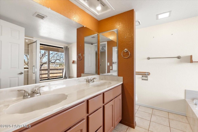 full bathroom with tile patterned flooring, double vanity, visible vents, and a sink