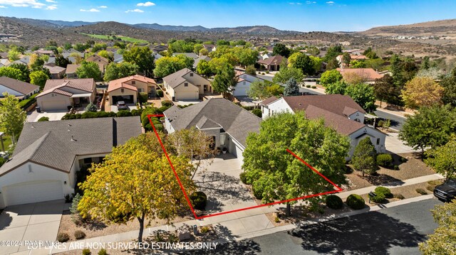 birds eye view of property featuring a mountain view