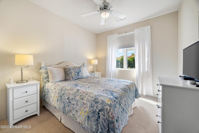 carpeted bedroom featuring ceiling fan