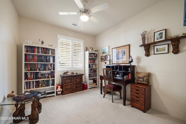 office space with ceiling fan and light colored carpet