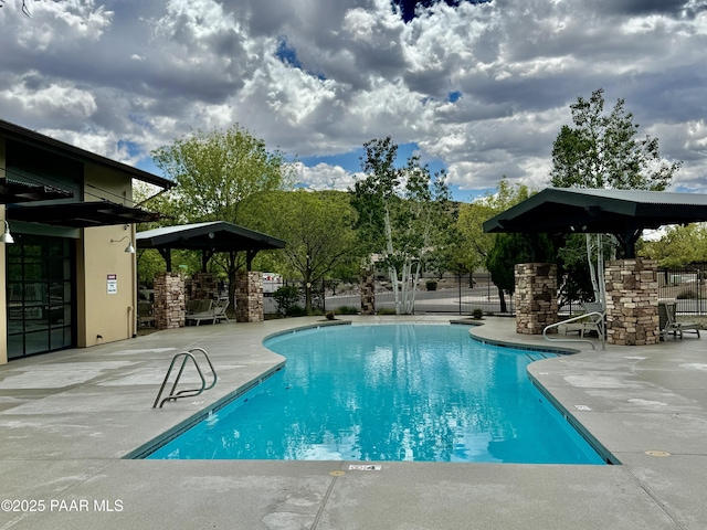 7218 E Night Watch Way, Prescott Valley, AZ 86314 - community pool with a gazebo, fence, and a patio area